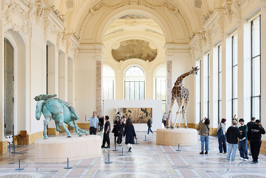Visitors exploring contemporary artworks during Art Basel Paris at the Grand Palais